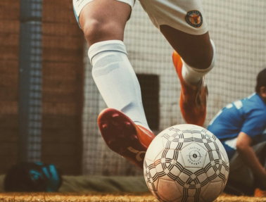 person-in-white-and-red-soccer-jersey-kicking-soccer-ball.jpg person in white and red soccer jersey kicking soccer ball